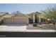 Charming single Gathering home with a three car garage and low maintenance desert landscaping at 18873 N 94Th Way, Scottsdale, AZ 85255