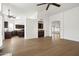 Open concept living room with hardwood floors, bar area, and views of the kitchen at 18873 N 94Th Way, Scottsdale, AZ 85255