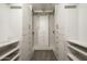 Walk-in closet with custom shelving and drawers for ample storage space at 18873 N 94Th Way, Scottsdale, AZ 85255