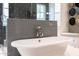 Elegant bathroom with a freestanding tub, stylish tile, and custom finishes at 18927 N 101St St, Scottsdale, AZ 85255