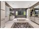 Beautiful bathroom with freestanding tub, glass-enclosed shower, dual vanities, and modern finishes at 18927 N 101St St, Scottsdale, AZ 85255