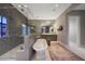 Spacious bathroom with a freestanding tub, walk-in shower, dual vanities, and stylish accents at 18927 N 101St St, Scottsdale, AZ 85255