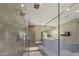 Beautiful shower, with great tile and lighting, inside this upscale home's relaxing bathroom at 18927 N 101St St, Scottsdale, AZ 85255
