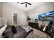 A calm bedroom features a comfortable bed, modern décor, and a large screen television at 18927 N 101St St, Scottsdale, AZ 85255