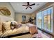 Bright bedroom featuring a comfortable bed, large windows, and tasteful decor at 18927 N 101St St, Scottsdale, AZ 85255