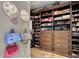 Custom walk-in closet with built-in shelving and storage solutions to accommodate an extensive wardrobe at 18927 N 101St St, Scottsdale, AZ 85255