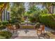 Inviting courtyard features a tranquil water fountain, lush greenery, and comfortable benches at 18927 N 101St St, Scottsdale, AZ 85255
