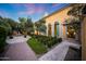 Beautiful courtyard with stone walkway, manicured hedges, and fountain at 18927 N 101St St, Scottsdale, AZ 85255
