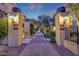 Elegant entryway with brick pathway and landscaped garden welcomes visitors at 18927 N 101St St, Scottsdale, AZ 85255