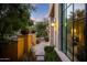 Charming entryway with tiled walkway and decorative potted plants at 18927 N 101St St, Scottsdale, AZ 85255