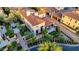 An aerial view shows the backyard and patio area, with seating, a fire pit, landscaping, and a fountain in the front at 18927 N 101St St, Scottsdale, AZ 85255