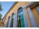 Close-up of exterior featuring tall arched windows providing ample natural light at 18927 N 101St St, Scottsdale, AZ 85255