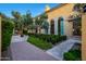 Picturesque facade with large arched windows, and mature trees at 18927 N 101St St, Scottsdale, AZ 85255