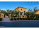 Elegant two-story home with lush landscaping and unique architectural details at 18927 N 101St St, Scottsdale, AZ 85255
