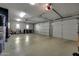Spacious three-car garage providing ample parking and storage with windows for natural light at 18927 N 101St St, Scottsdale, AZ 85255