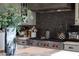 Gourmet kitchen features a Wolf range, mosaic backsplash, and custom vent hood at 18927 N 101St St, Scottsdale, AZ 85255