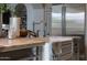Close up on an undermount kitchen sink and faucet fixture with white marble counter at 18927 N 101St St, Scottsdale, AZ 85255