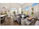 Bright and airy living room with high ceilings, large windows, and hardwood floors at 18927 N 101St St, Scottsdale, AZ 85255
