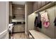 Well-organized mudroom with bench seating, cabinetry, and convenient laundry area at 18927 N 101St St, Scottsdale, AZ 85255