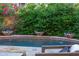 Tranquil pool with decorative water features surrounded by lush greenery and flowers at 18927 N 101St St, Scottsdale, AZ 85255
