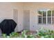 Covered patio with security doors, grill, and easy access to the backyard at 19127 N 79Th Dr, Glendale, AZ 85308