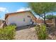 The backyard has low maintenance landscaping and a covered patio for relaxing and enjoying the outdoors at 19127 N 79Th Dr, Glendale, AZ 85308