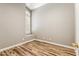 Bedroom with neutral paint, wood-look vinyl floors, and a window with shutters at 19127 N 79Th Dr, Glendale, AZ 85308