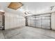 Spacious garage featuring ample storage cabinets and an automatic door at 19127 N 79Th Dr, Glendale, AZ 85308