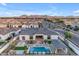 Expansive aerial view of a community featuring luxurious pools and desert landscaping at 20426 E Arroyo Verde Dr, Queen Creek, AZ 85142