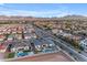 Aerial view of homes in a neighborhood with desert landscaping and mountain views at 20426 E Arroyo Verde Dr, Queen Creek, AZ 85142