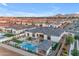 Stunning aerial view of a luxury home showcasing a private pool, pristine landscaping, and mountain views at 20426 E Arroyo Verde Dr, Queen Creek, AZ 85142