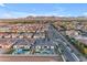 Gorgeous aerial view of a community showcasing desert landscaping and mountain views at 20426 E Arroyo Verde Dr, Queen Creek, AZ 85142