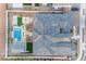 Aerial view of backyard featuring pool, fire pit, lounge area, and covered patio at 20426 E Arroyo Verde Dr, Queen Creek, AZ 85142