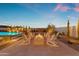Relaxing backyard oasis featuring a fire pit and pool at 20426 E Arroyo Verde Dr, Queen Creek, AZ 85142