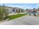Expansive backyard showcasing the sparkling pool, outdoor kitchen, and well-manicured landscaping at 20426 E Arroyo Verde Dr, Queen Creek, AZ 85142