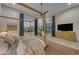 Comfortable bedroom with a view of the exterior patio at 20426 E Arroyo Verde Dr, Queen Creek, AZ 85142