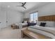 Bright bedroom with two beds, stylish decor, and a ceiling fan for added comfort at 20426 E Arroyo Verde Dr, Queen Creek, AZ 85142
