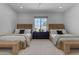 Bedroom featuring two beds, a window, neutral tones and a ceiling fan at 20426 E Arroyo Verde Dr, Queen Creek, AZ 85142