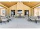Beautiful outdoor clubhouse area with tables, seating, fireplace and TV perfect for entertaining friends and Gathering at 20426 E Arroyo Verde Dr, Queen Creek, AZ 85142