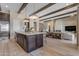 Large kitchen island with modern fixtures in an open-concept living space at 20426 E Arroyo Verde Dr, Queen Creek, AZ 85142