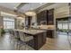 Beautiful kitchen with a large island, pendant lighting, and stylish seating, ideal for cooking and entertaining at 20426 E Arroyo Verde Dr, Queen Creek, AZ 85142