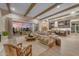 Open-concept living space with beamed ceilings, hardwood floors, and natural light at 20426 E Arroyo Verde Dr, Queen Creek, AZ 85142
