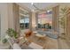 Bright living room with large windows, modern furniture, and stylish decor at 20426 E Arroyo Verde Dr, Queen Creek, AZ 85142