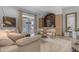 Comfortable living room with a plush sofa, stylish chairs, and a view of the outdoor patio at 20426 E Arroyo Verde Dr, Queen Creek, AZ 85142