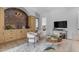 Stylish entertainment area includes a bar, plush seating, and media center for a complete experience at 20426 E Arroyo Verde Dr, Queen Creek, AZ 85142