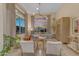 Bright and airy living room featuring large windows offering sunset views and designer decor at 20426 E Arroyo Verde Dr, Queen Creek, AZ 85142