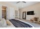 Spacious main bedroom features modern decor, neutral colors and ensuite bathroom entrance at 20426 E Arroyo Verde Dr, Queen Creek, AZ 85142