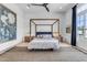 Bright main bedroom with a four-poster bed, ceiling fan, and stylish decor at 20426 E Arroyo Verde Dr, Queen Creek, AZ 85142