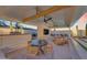 Wonderful outdoor covered patio features a built-in BBQ, dining area, stone accents and comfortable seating at 20426 E Arroyo Verde Dr, Queen Creek, AZ 85142