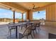 Outdoor kitchen with grills, tables, and chairs, providing a great space for cooking and dining outdoors at 20426 E Arroyo Verde Dr, Queen Creek, AZ 85142